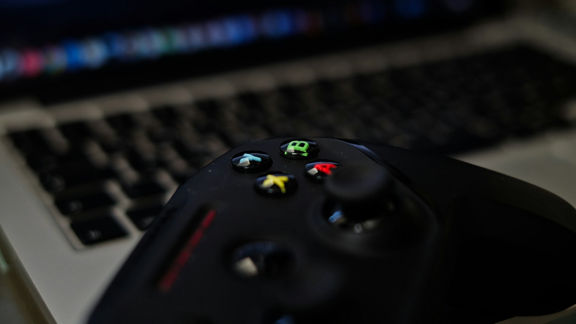 Player at a glowing desk setup reviewing a game